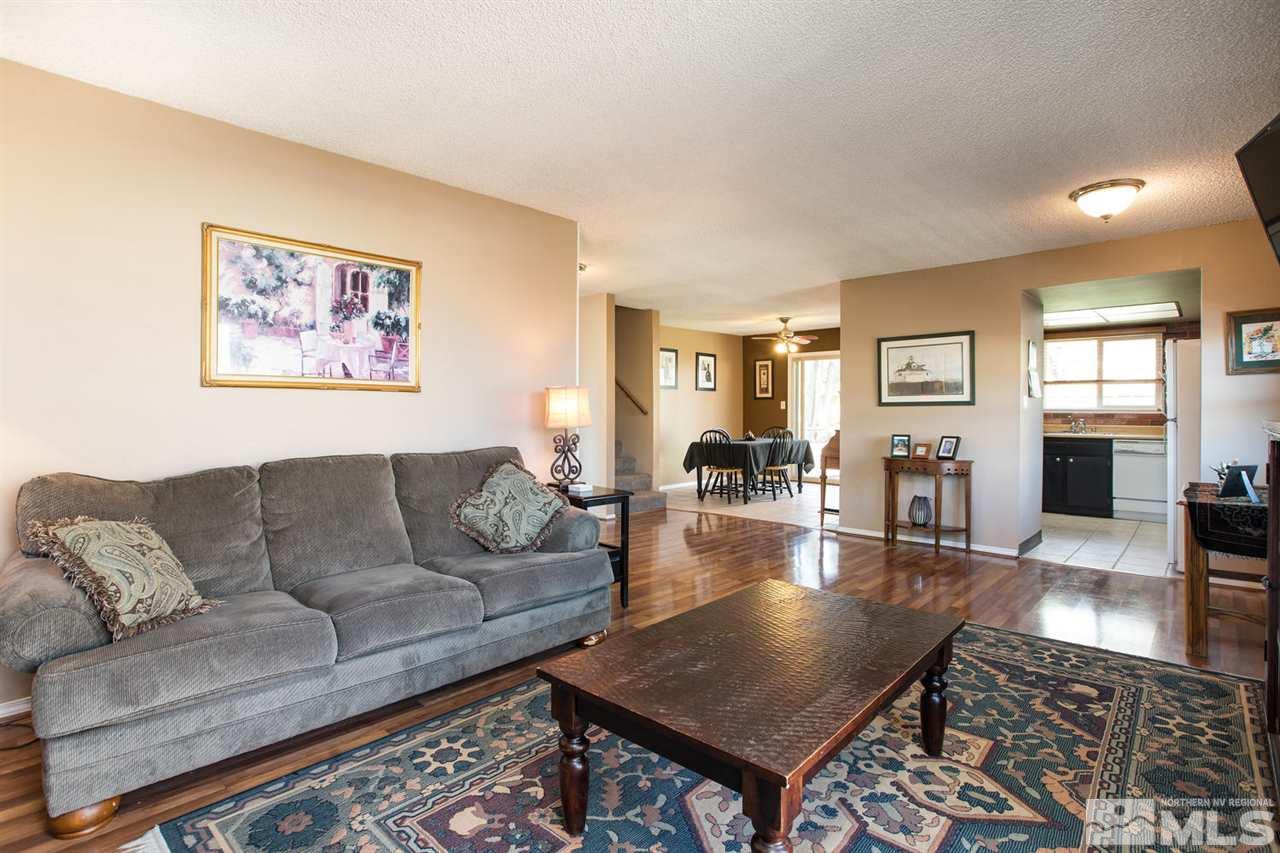 1845 Kings Row Reno, NV 89503 - Photo 5 of 25 a living room with furniture a table and wooden floor