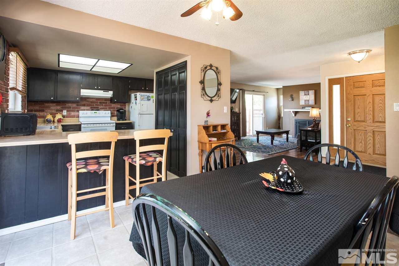 1845 Kings Row Reno, NV 89503 - Photo 10 of 25 a view of a dining room with furniture and a chandelier