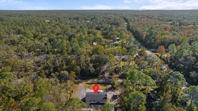 an aerial view of mountain with yard