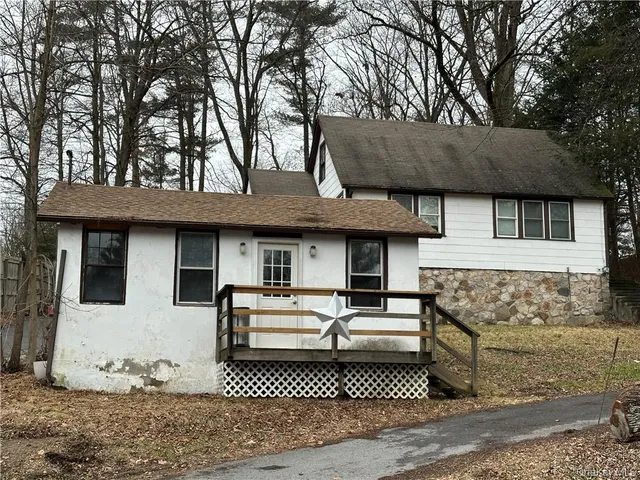 a front view of a house with garage