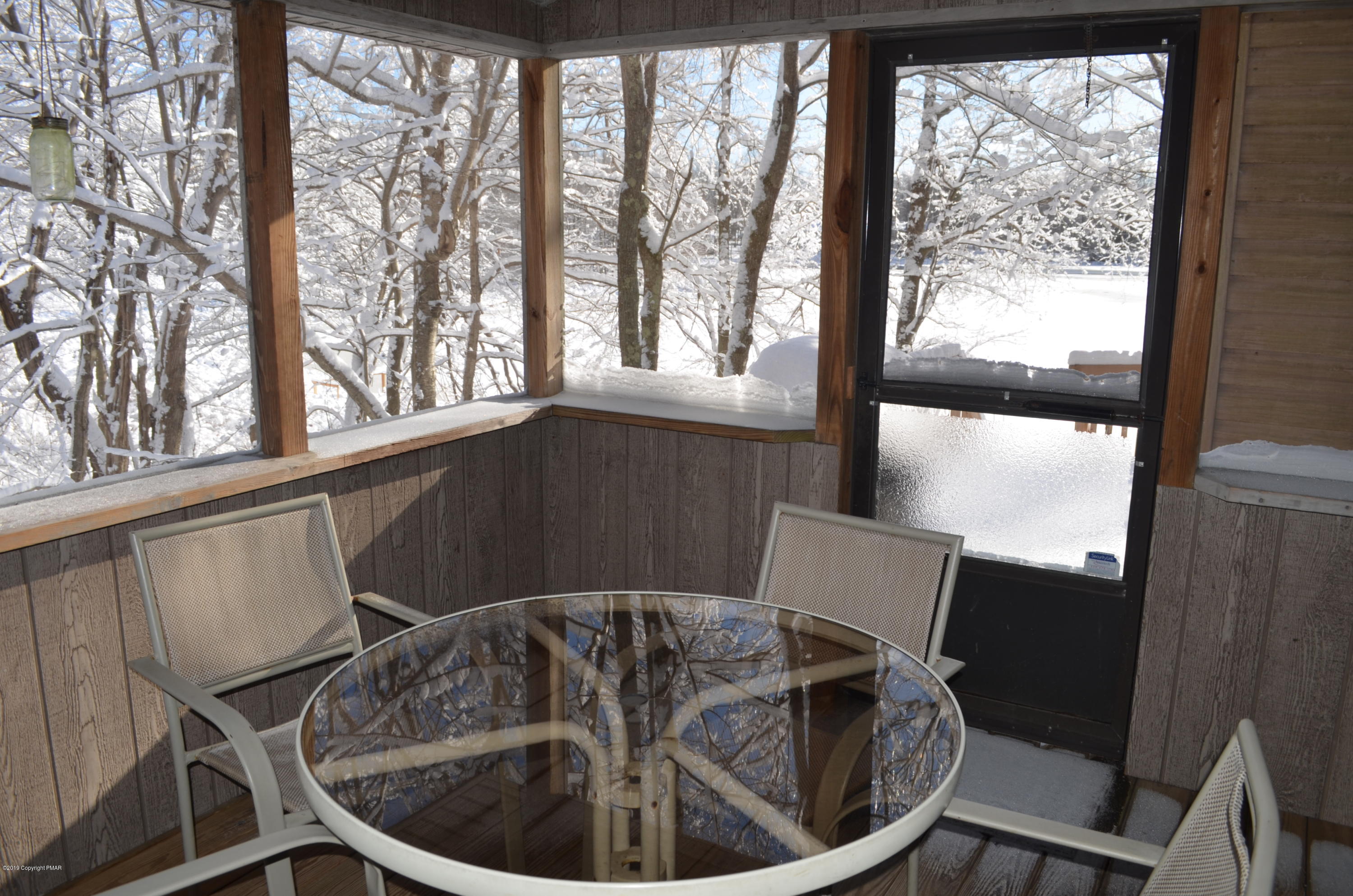 9 Birch Point Road Gouldsboro, PA 18424 - Photo 13 of 41 a view of a dining room with furniture window and outside view