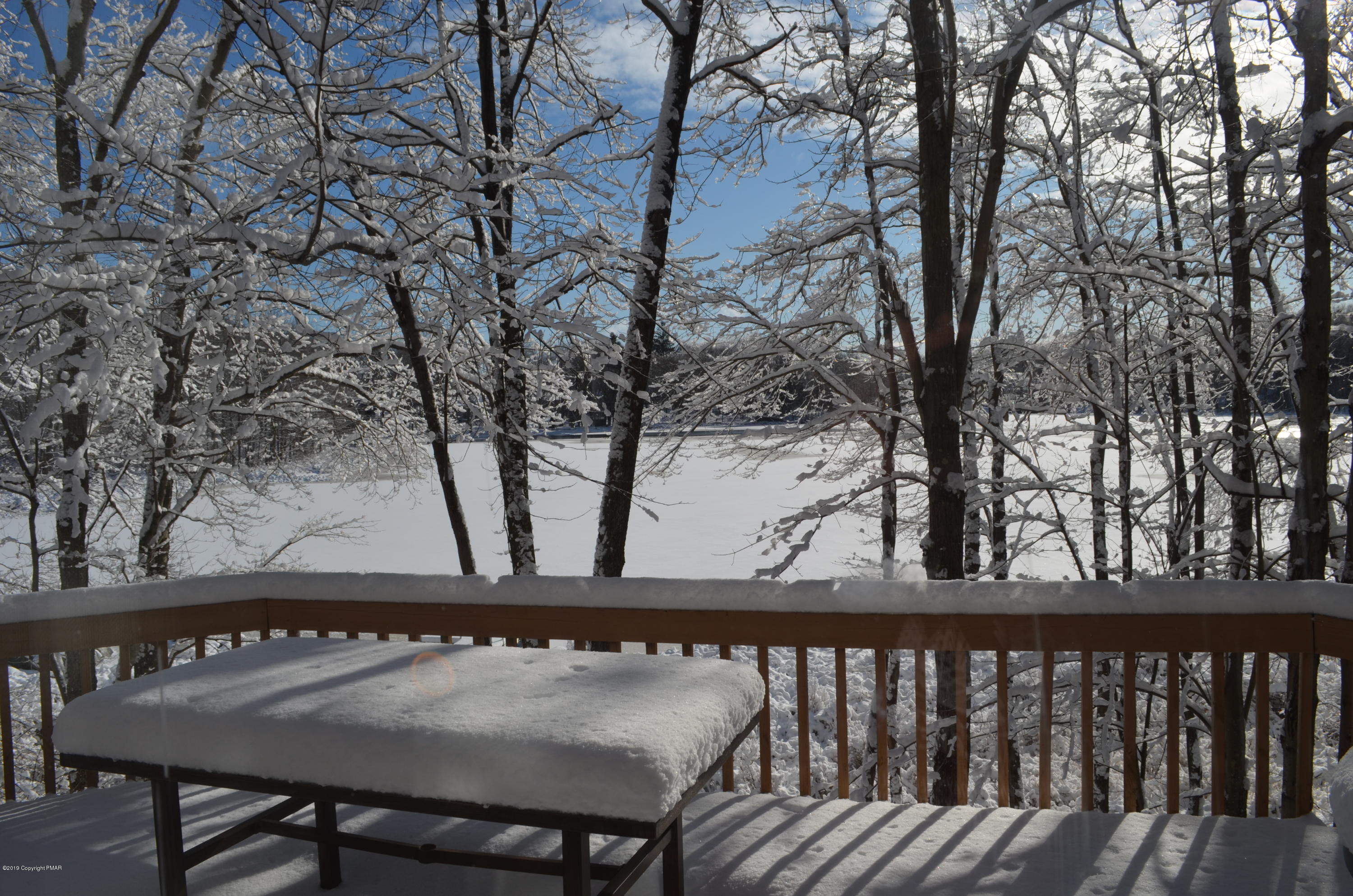 9 Birch Point Road Gouldsboro, PA 18424 - Photo 14 of 41 a view of backyard with a deck and wooden floor
