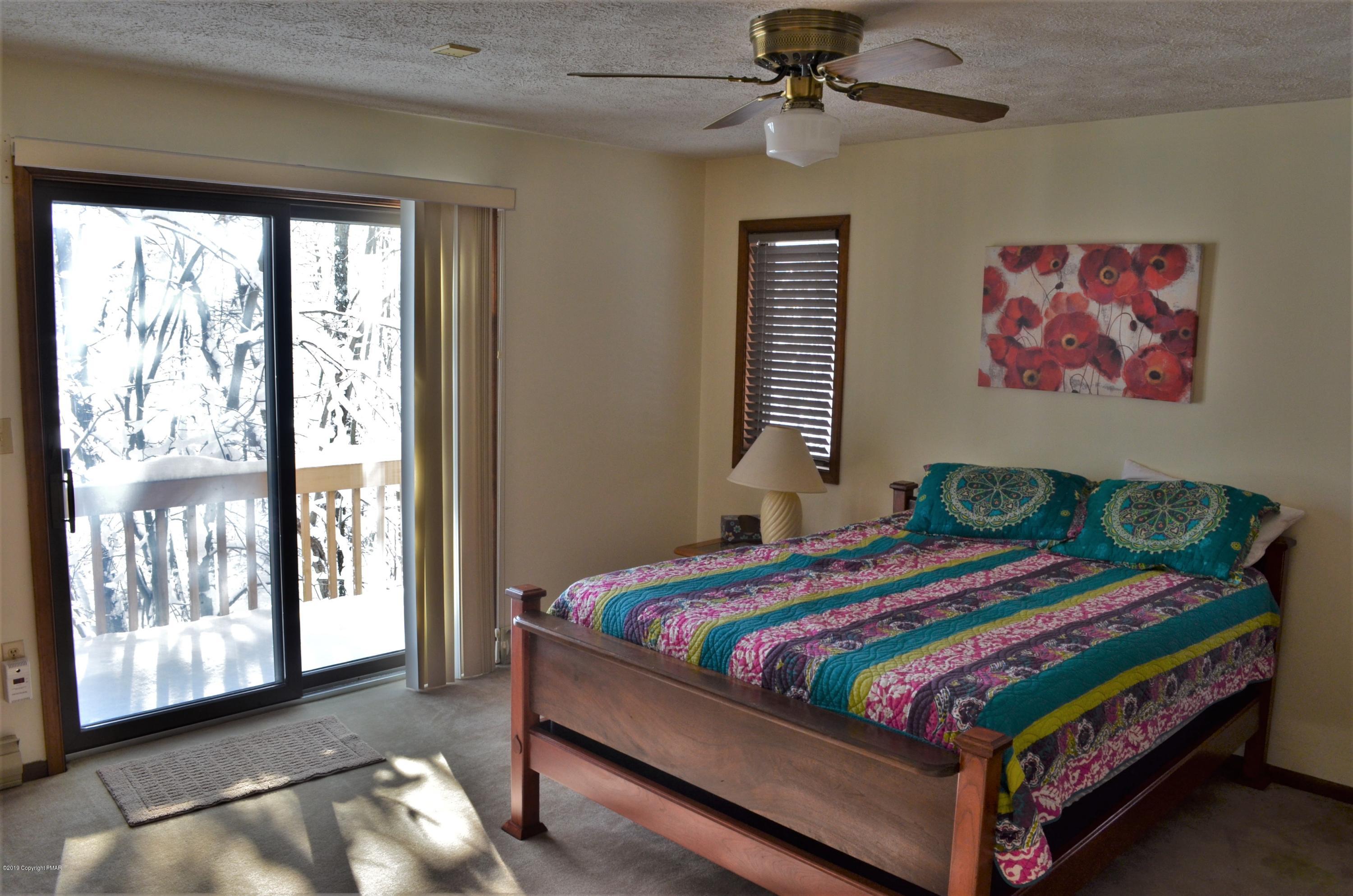 9 Birch Point Road Gouldsboro, PA 18424 - Photo 17 of 41 a bedroom with a bed and window