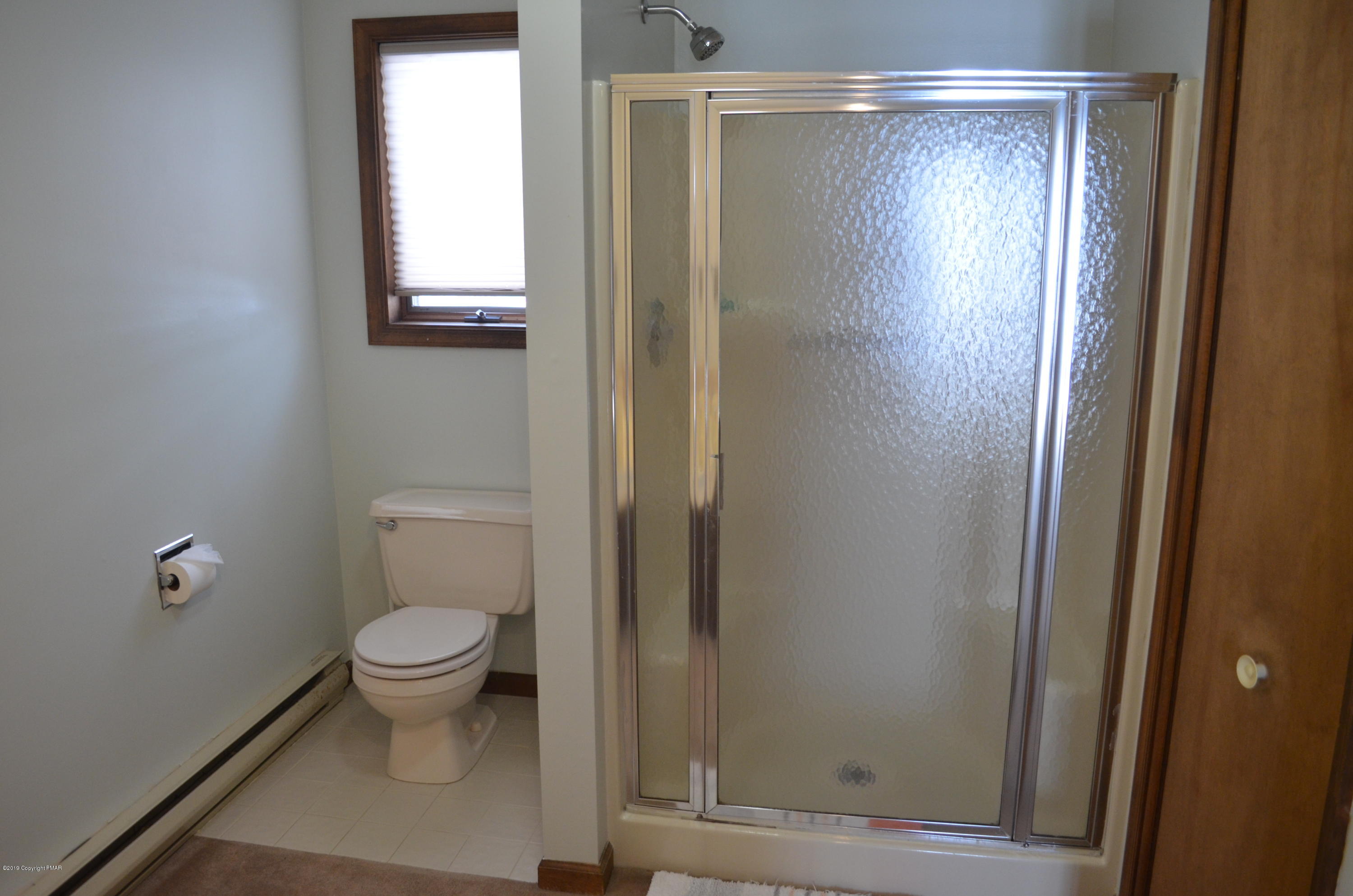 9 Birch Point Road Gouldsboro, PA 18424 - Photo 21 of 41 a bathroom with a shower a toilet and a sink