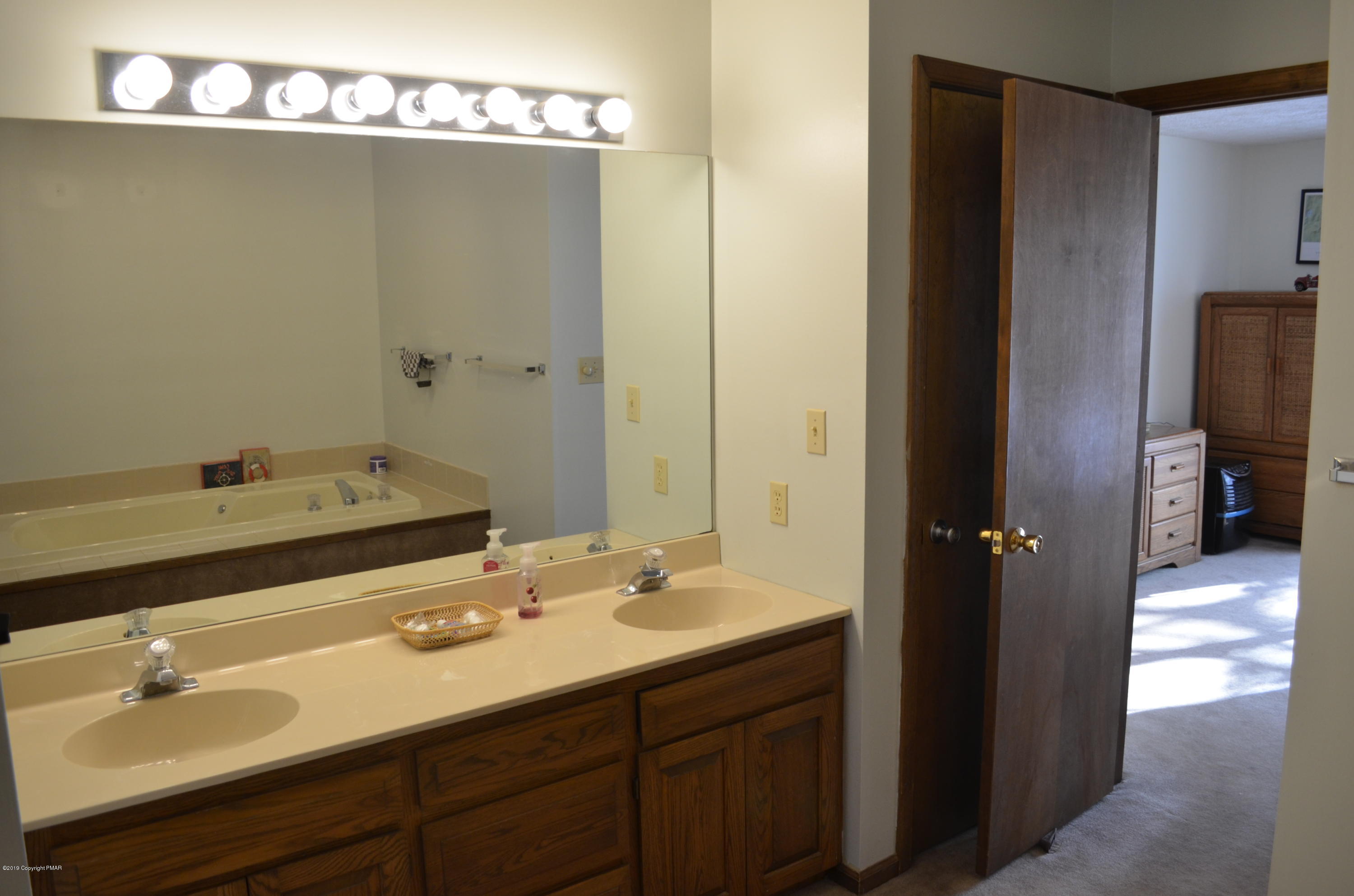 9 Birch Point Road Gouldsboro, PA 18424 - Photo 22 of 41 a bathroom with a sink and a mirror