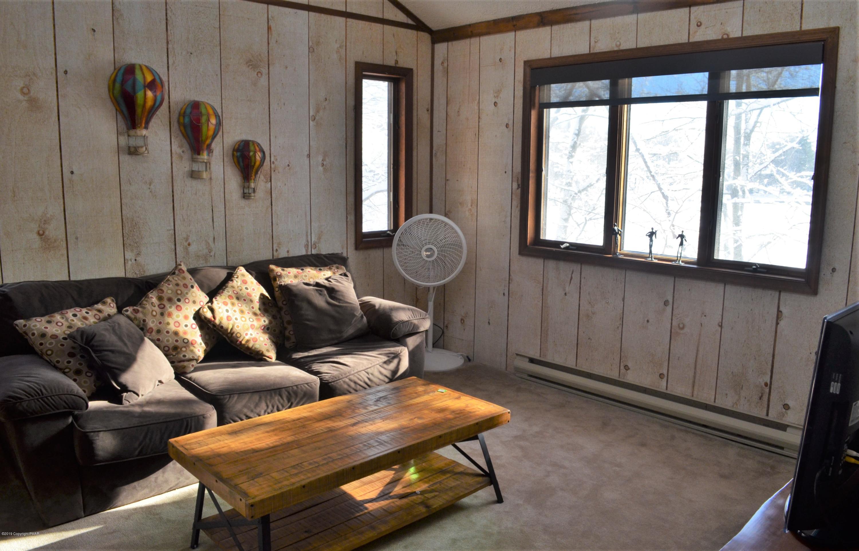 9 Birch Point Road Gouldsboro, PA 18424 - Photo 27 of 41 a living room with furniture and a window