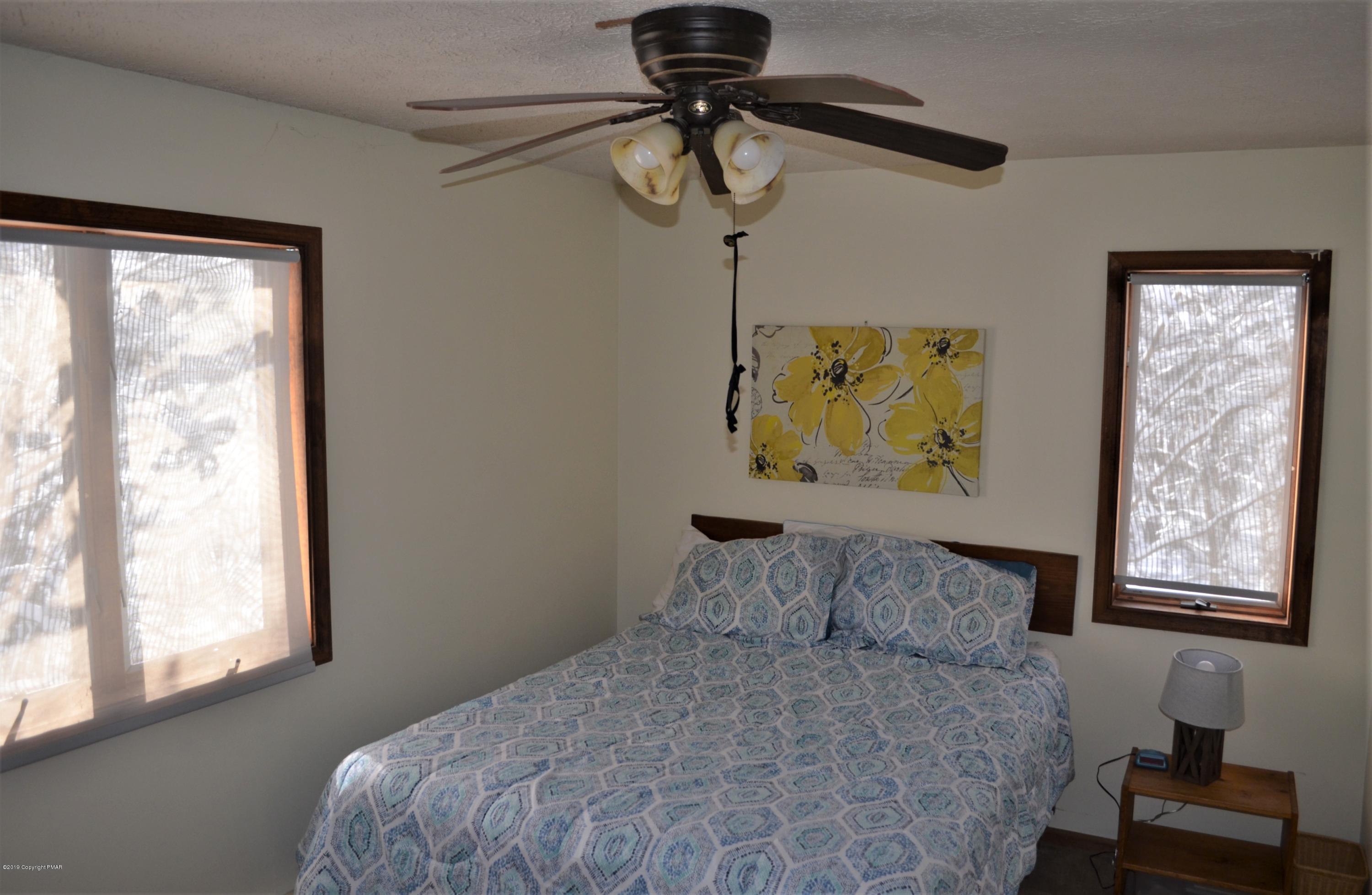 9 Birch Point Road Gouldsboro, PA 18424 - Photo 31 of 41 a bedroom with a bed and a window