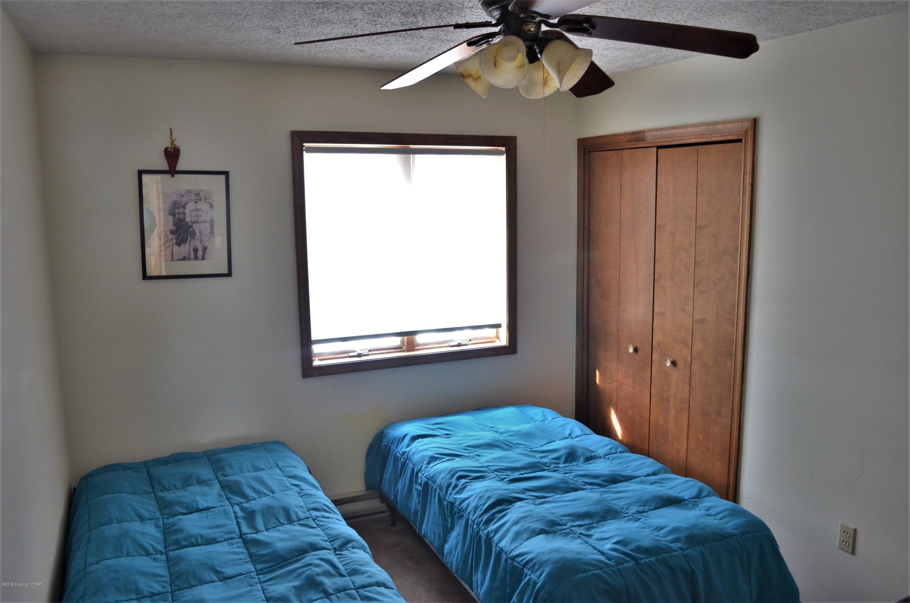 9 Birch Point Road Gouldsboro, PA 18424 - Photo 32 of 41 a bedroom with bed and a window