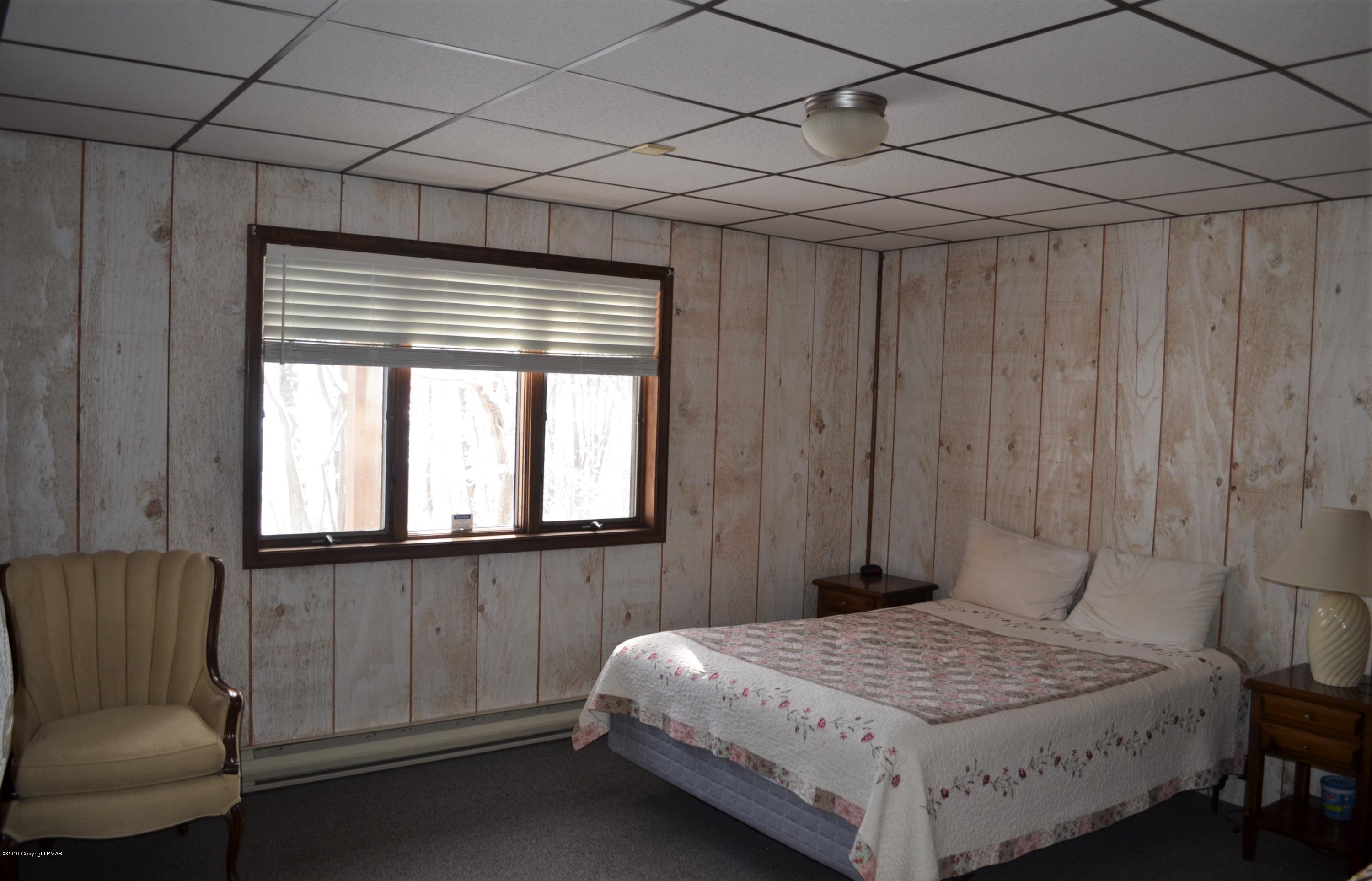 9 Birch Point Road Gouldsboro, PA 18424 - Photo 34 of 41 a bedroom with a bed and a window