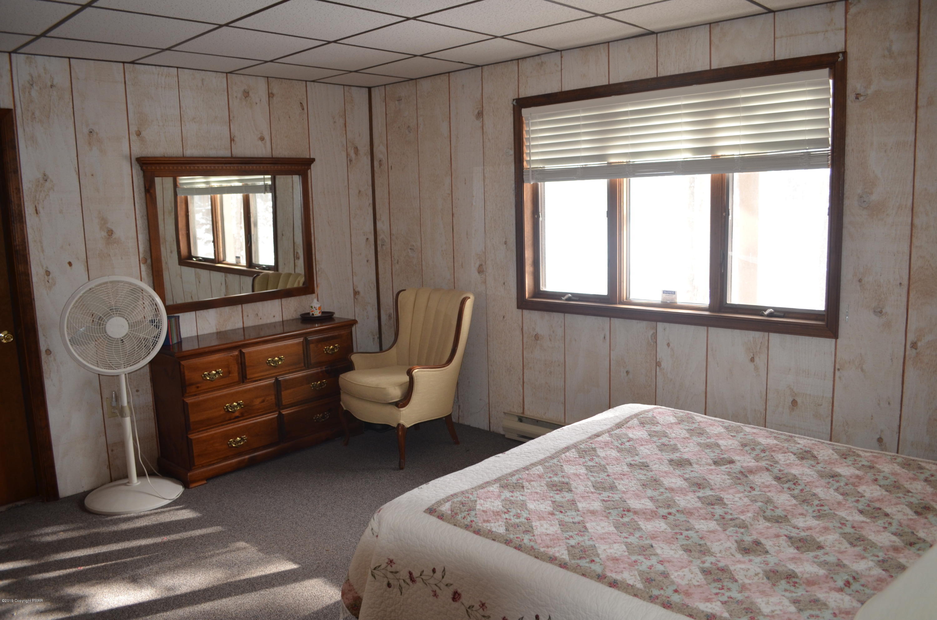 9 Birch Point Road Gouldsboro, PA 18424 - Photo 35 of 41 a bedroom with a bed and windows