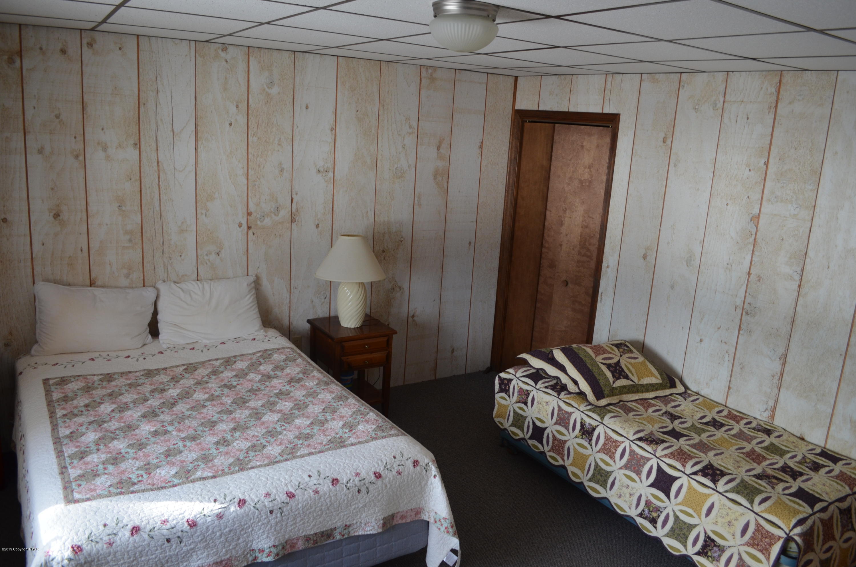 9 Birch Point Road Gouldsboro, PA 18424 - Photo 36 of 41 a bedroom with a bed and a window