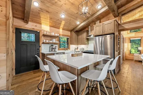 a outdoor living space with patio furniture and a fireplace