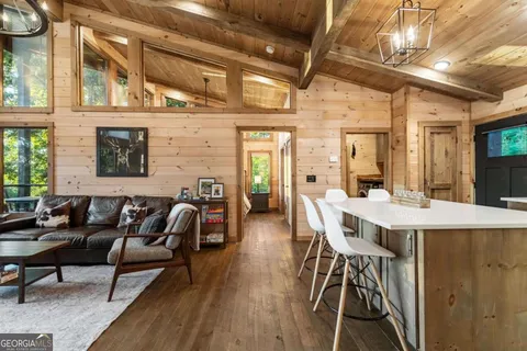 a bedroom with a bed and large window