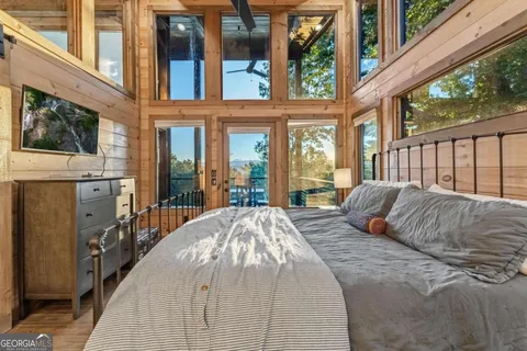 a view of a balcony with furniture and wooden floor
