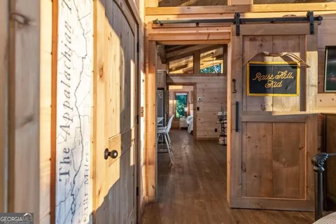 a view of backyard with a deck and wooden floor