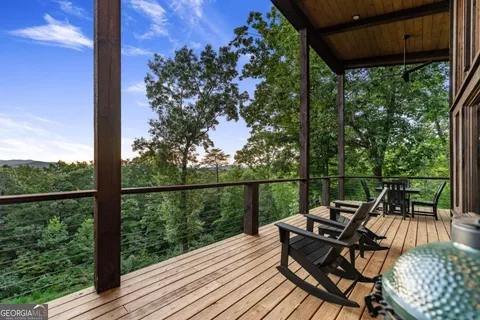 a view of a city with lush green forest