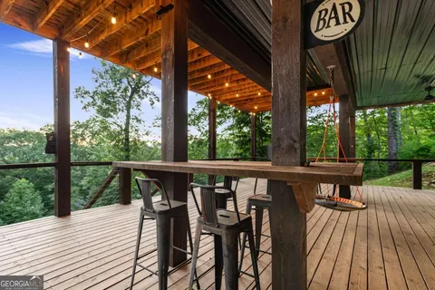 an aerial view of a house with yard and outdoor seating