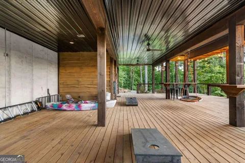 a view of a balcony with two chairs and a table