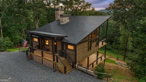 a view of a lake in middle of forest