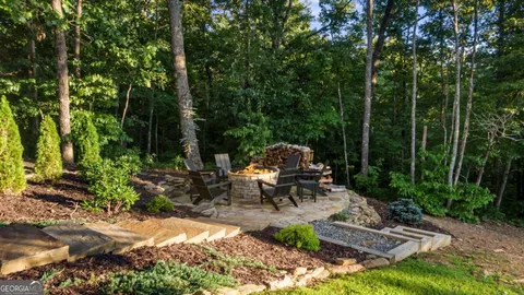 a kitchen with a stove a refrigerator and wooden cabinets