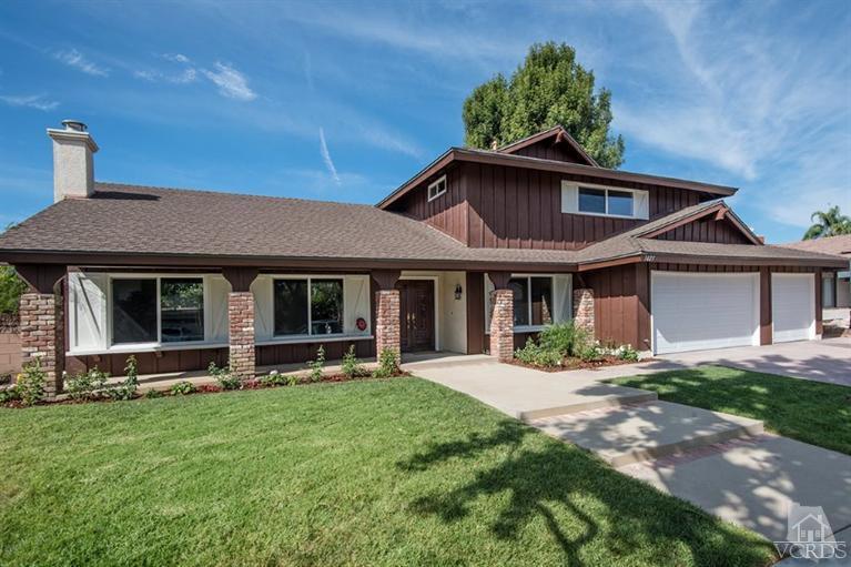 3025 Springfield Street Simi Valley, CA 93063 - Photo 1 of 24 a front view of a house with a yard and porch