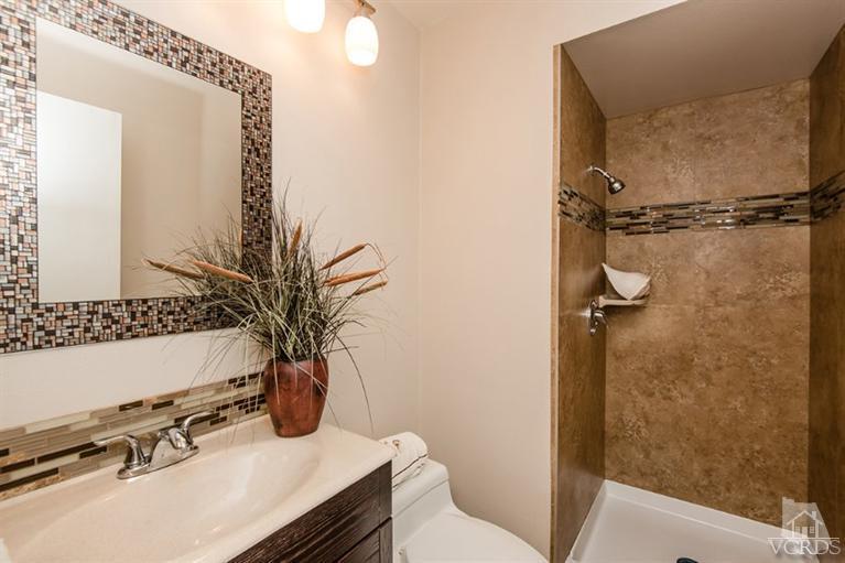 3025 Springfield Street Simi Valley, CA 93063 - Photo 12 of 24 a bathroom with a sink toilet and shower