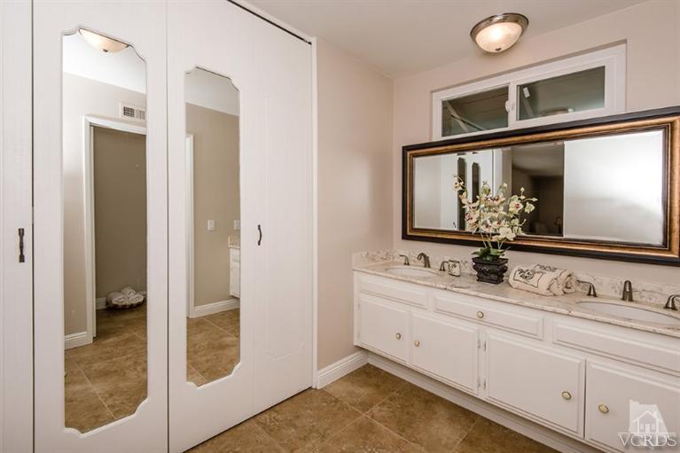 3025 Springfield Street Simi Valley, CA 93063 - Photo 17 of 24 a bathroom with a sink and a mirror