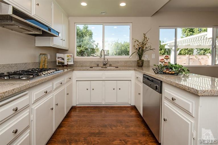 3025 Springfield Street Simi Valley, CA 93063 - Photo 7 of 24 a kitchen with a sink stove and cabinets