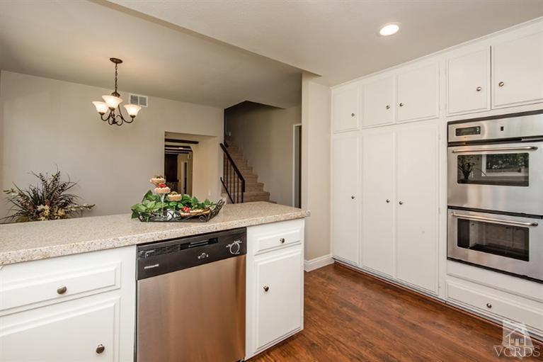 3025 Springfield Street Simi Valley, CA 93063 - Photo 8 of 24 a kitchen with a sink stainless steel appliances and cabinets