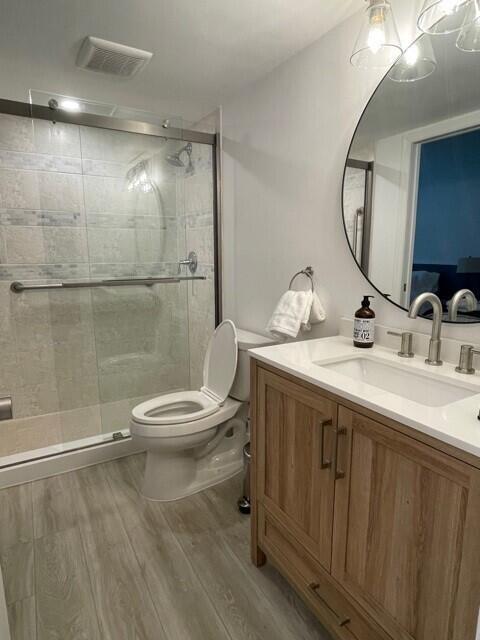 13400 Polo Road West Wellington, FL 33414 - Photo 15 of 16 a bathroom with a double vanity sink toilet and a mirror