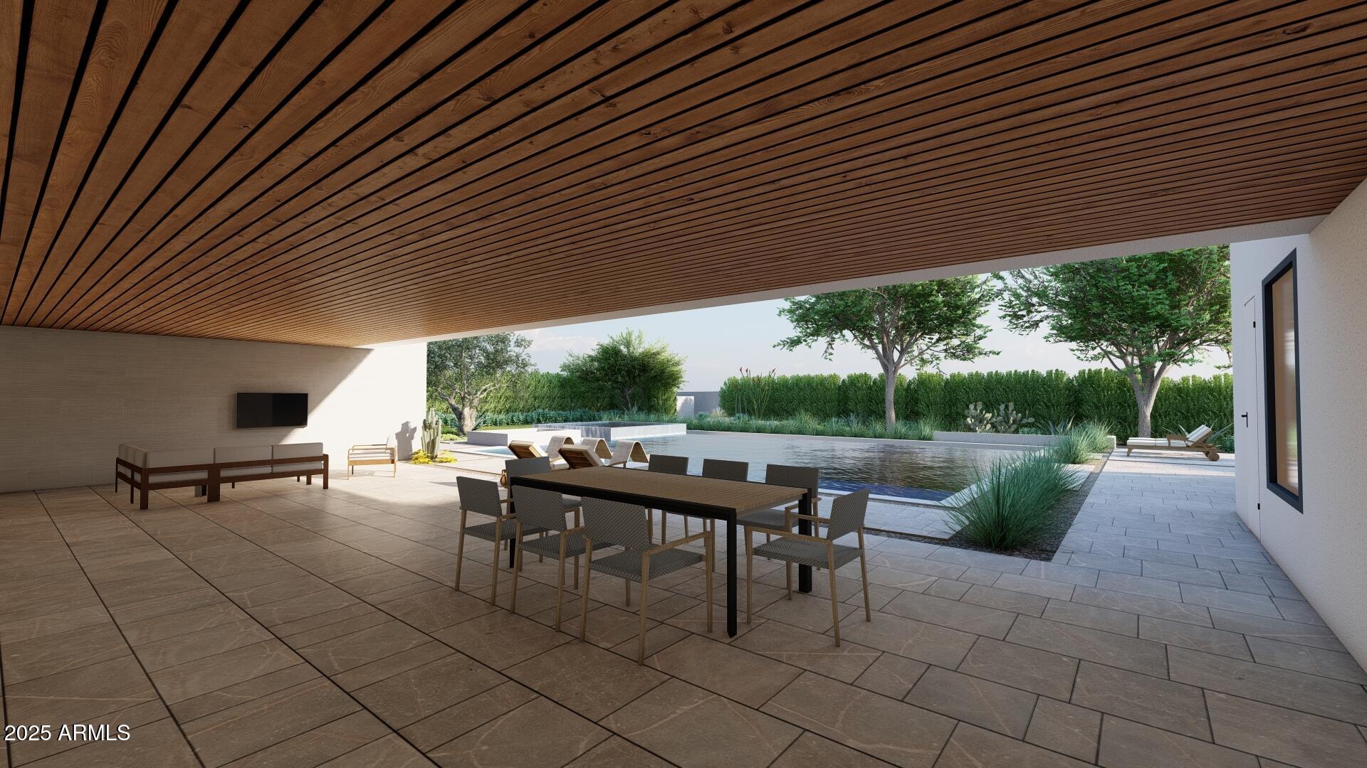 5305 North 68th Place Paradise Valley, AZ 85253 - Photo 52 of 65 a view of a patio with table and chairs under an umbrella