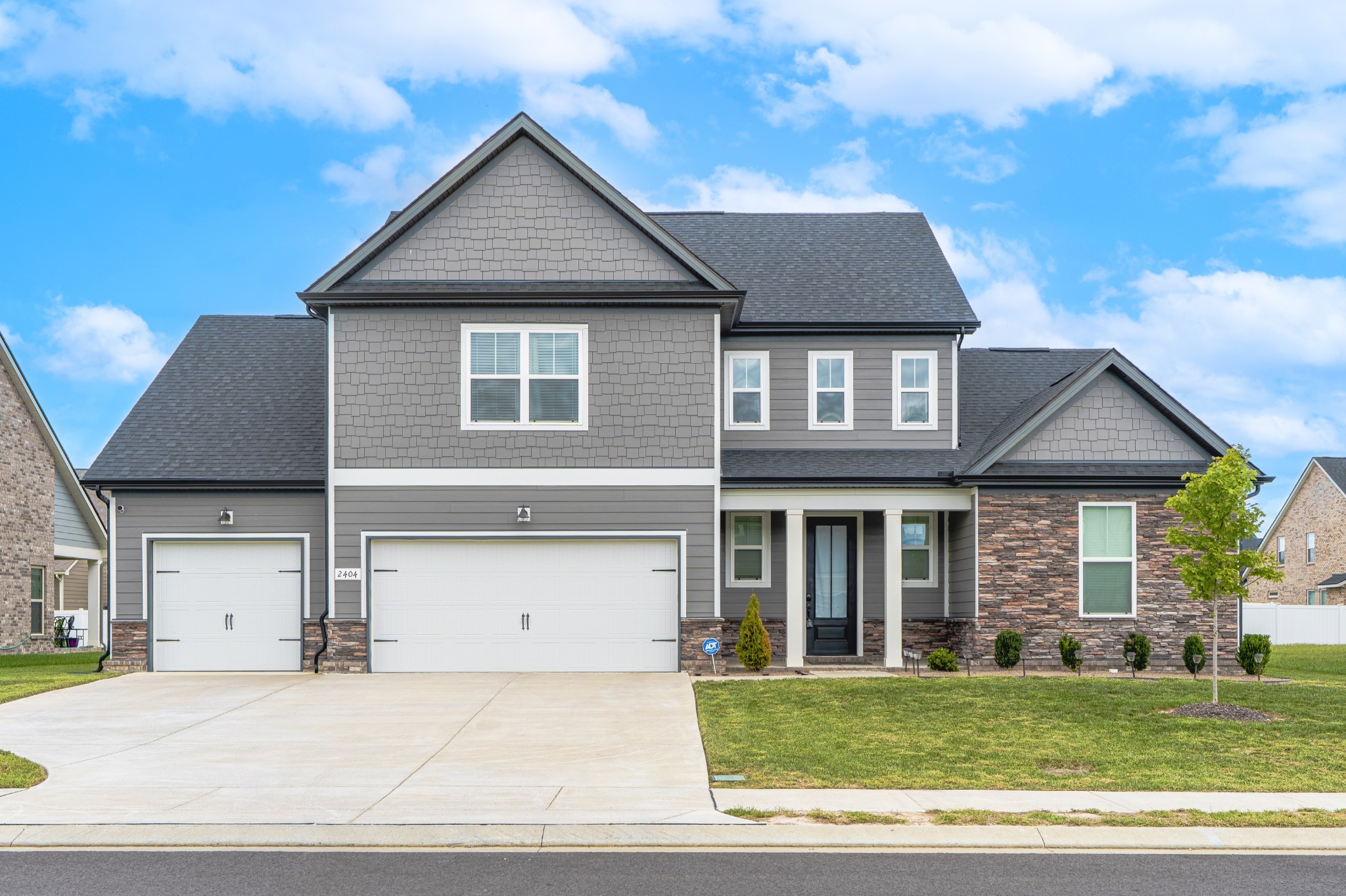 a front view of a house with a yard
