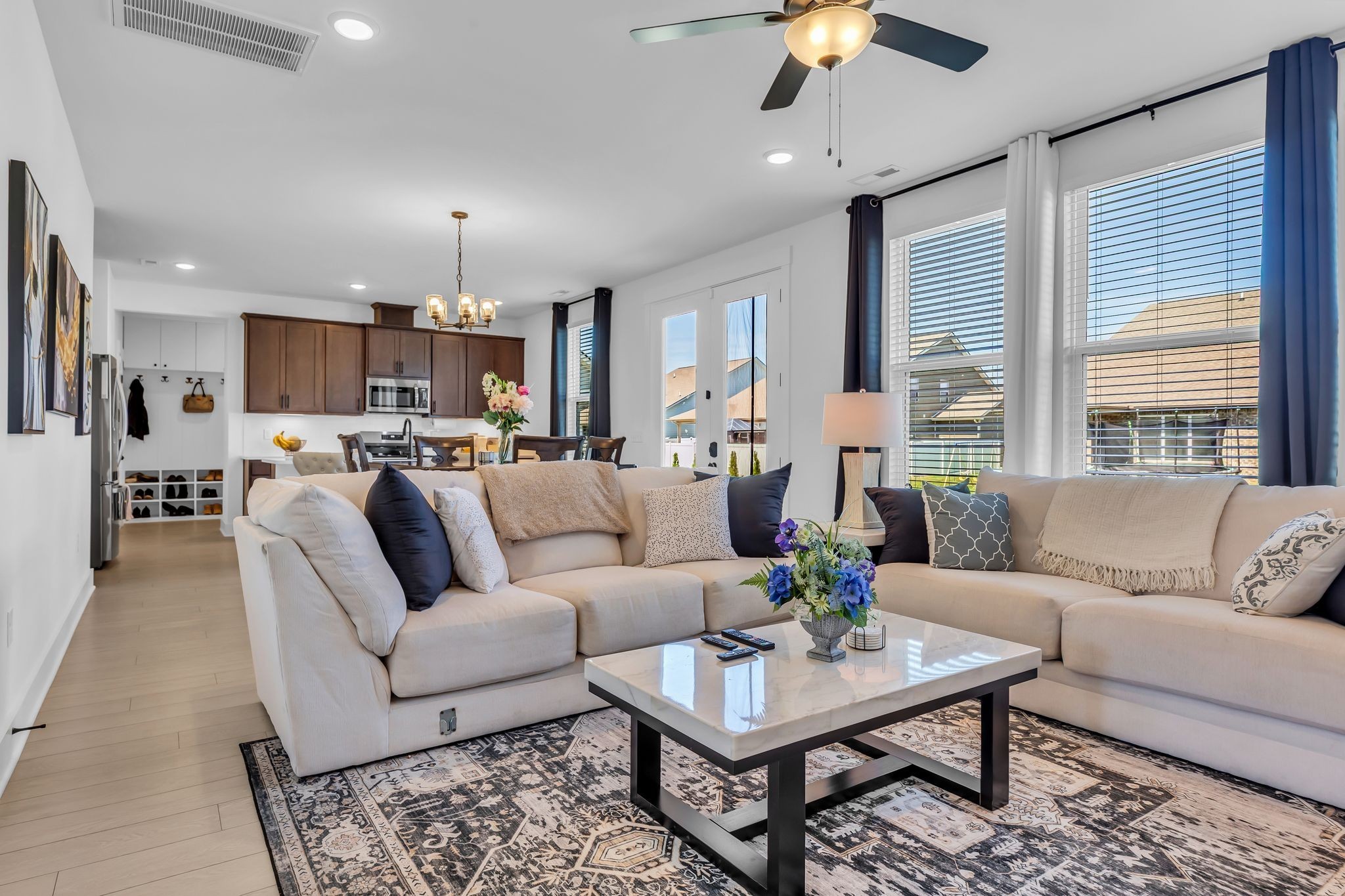 2404 Beaver Drive Murfreesboro, TN 37128 - Photo 12 of 42 a living room with furniture and a chandelier
