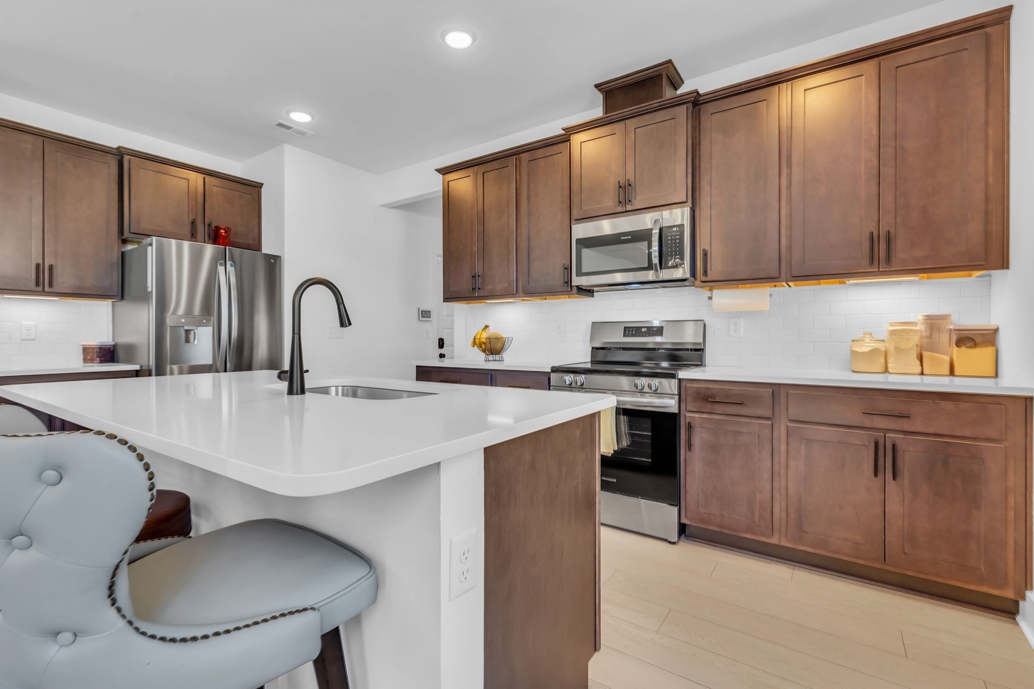 2404 Beaver Drive Murfreesboro, TN 37128 - Photo 16 of 42 a kitchen with stainless steel appliances a sink and cabinets