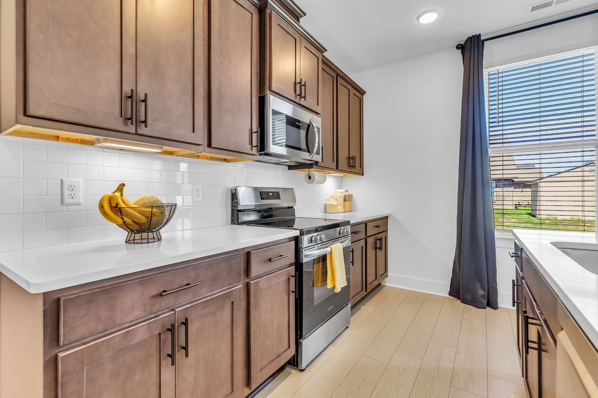 2404 Beaver Drive Murfreesboro, TN 37128 - Photo 17 of 42 a kitchen with stainless steel appliances granite countertop a sink a stove and a microwave