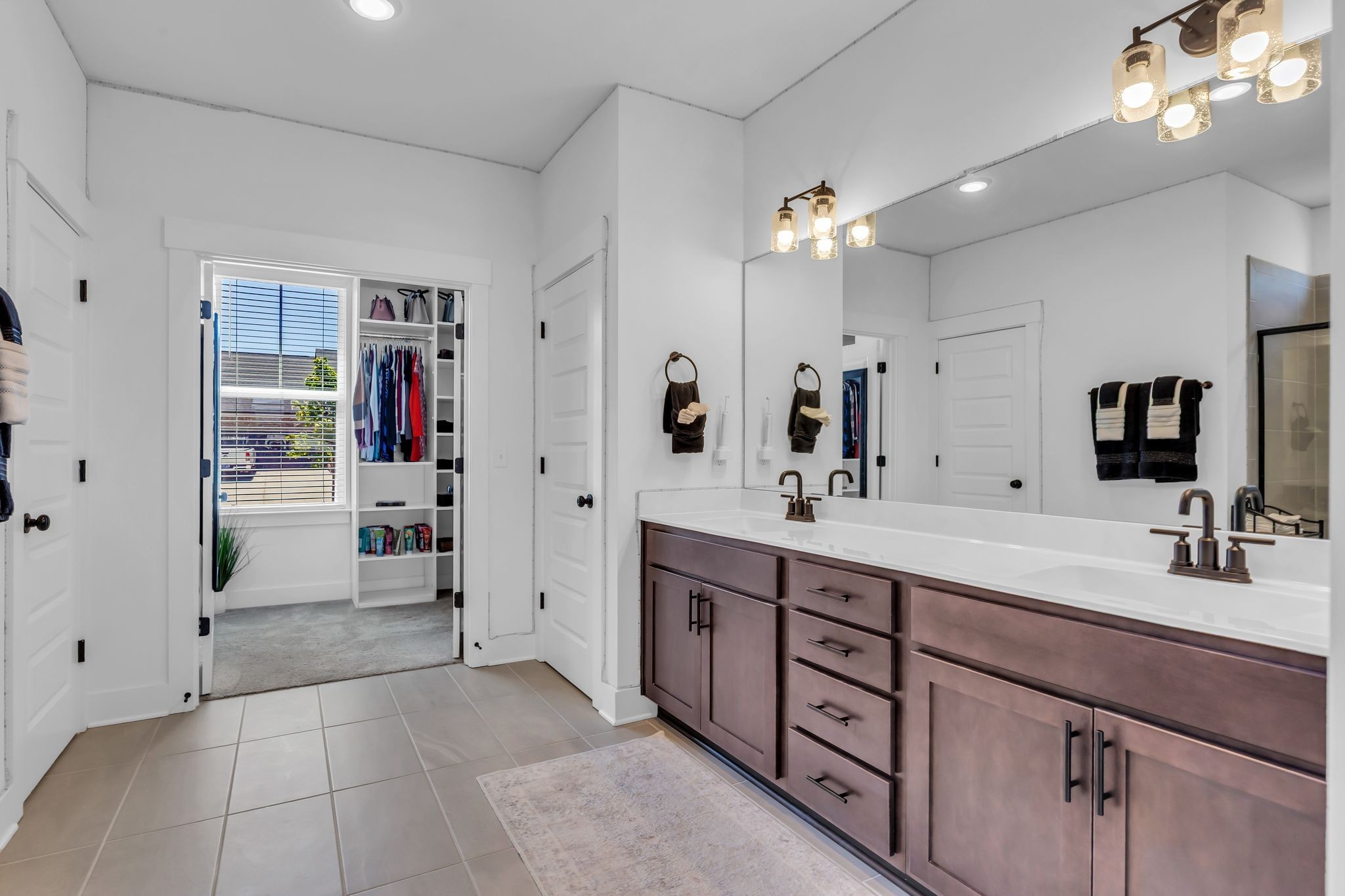 2404 Beaver Drive Murfreesboro, TN 37128 - Photo 23 of 42 a spacious bathroom with a double vanity sink a large mirror and shower