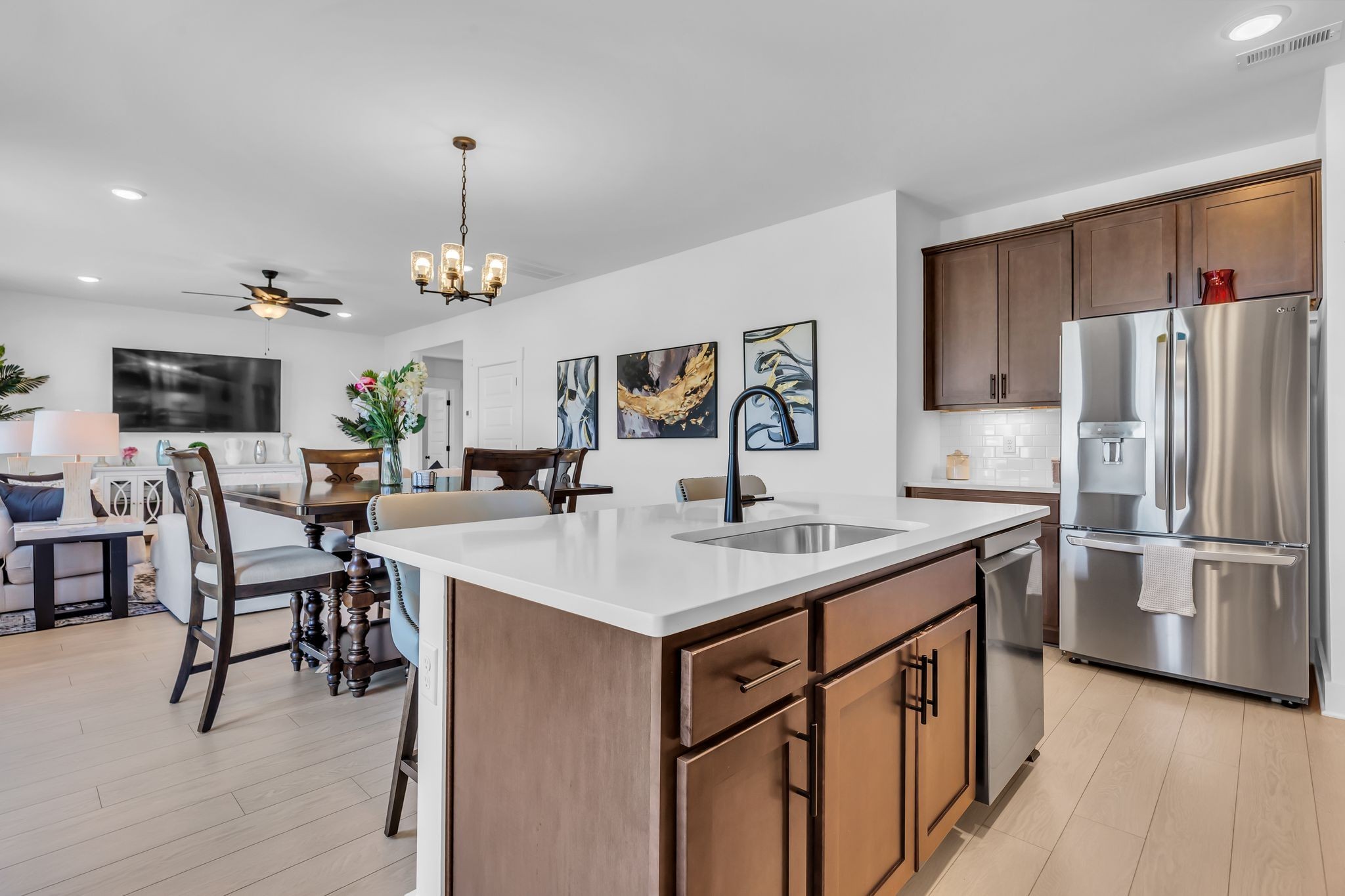 2404 Beaver Drive Murfreesboro, TN 37128 - Photo 27 of 42 a kitchen with stainless steel appliances granite countertop a kitchen island a stove a table and chairs
