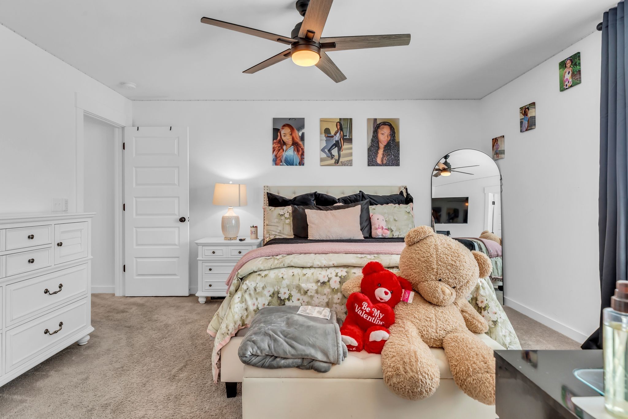 2404 Beaver Drive Murfreesboro, TN 37128 - Photo 28 of 42 a bedroom with a bed and a chandelier