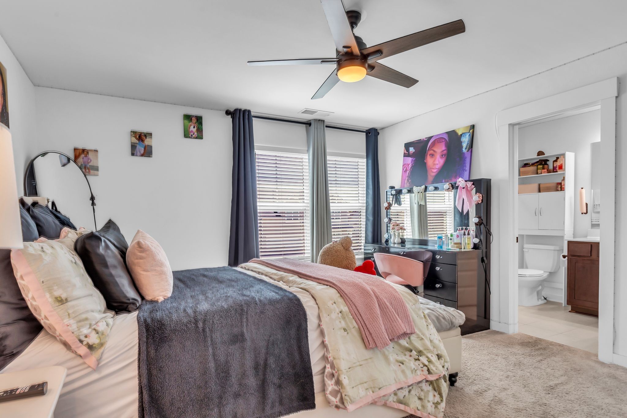 2404 Beaver Drive Murfreesboro, TN 37128 - Photo 29 of 42 a bedroom with a bed and a chandelier