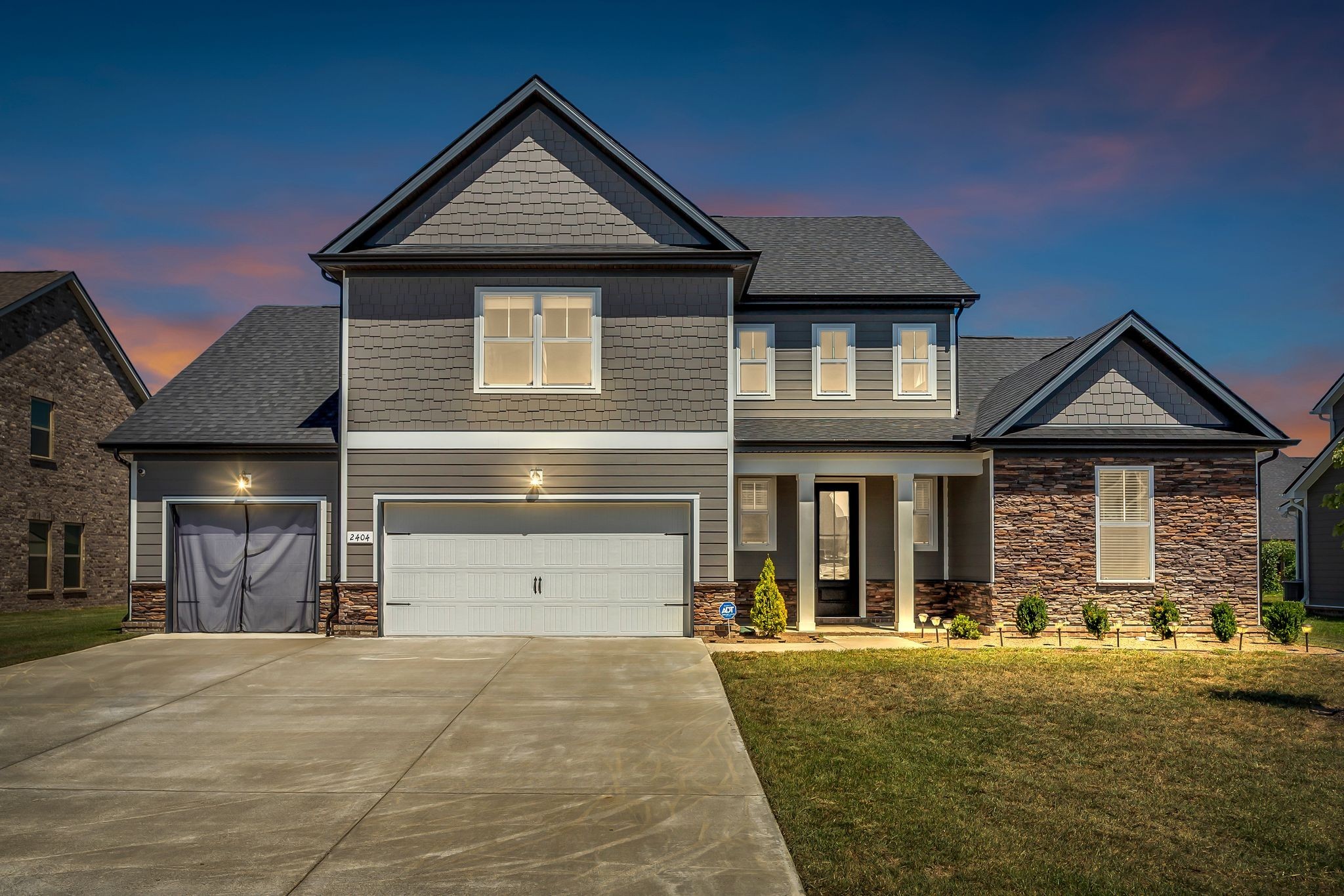 2404 Beaver Drive Murfreesboro, TN 37128 - Photo 3 of 42 a front view of a house with a yard and garage