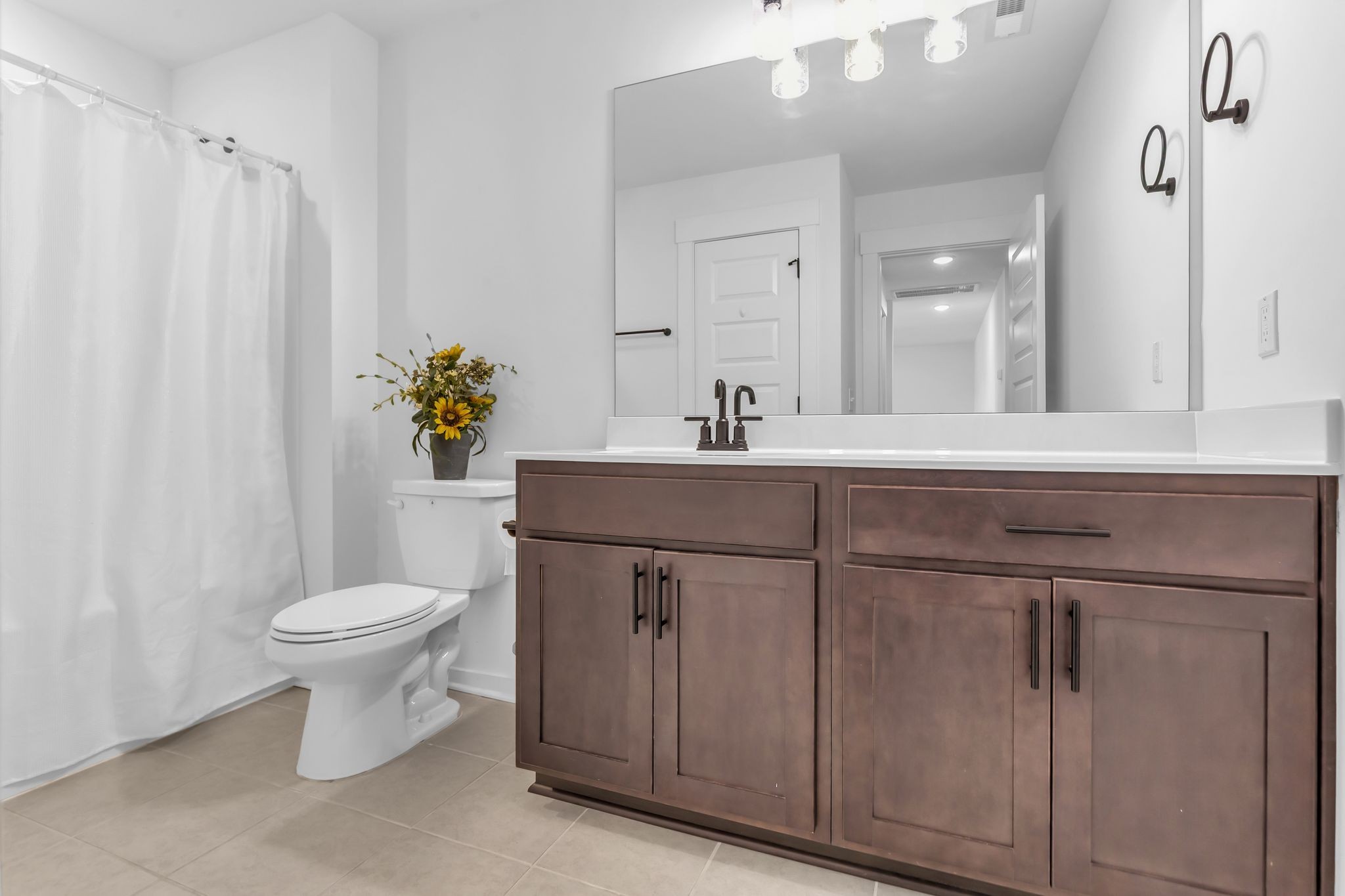 2404 Beaver Drive Murfreesboro, TN 37128 - Photo 31 of 42 a bathroom with a sink toilet and a mirror