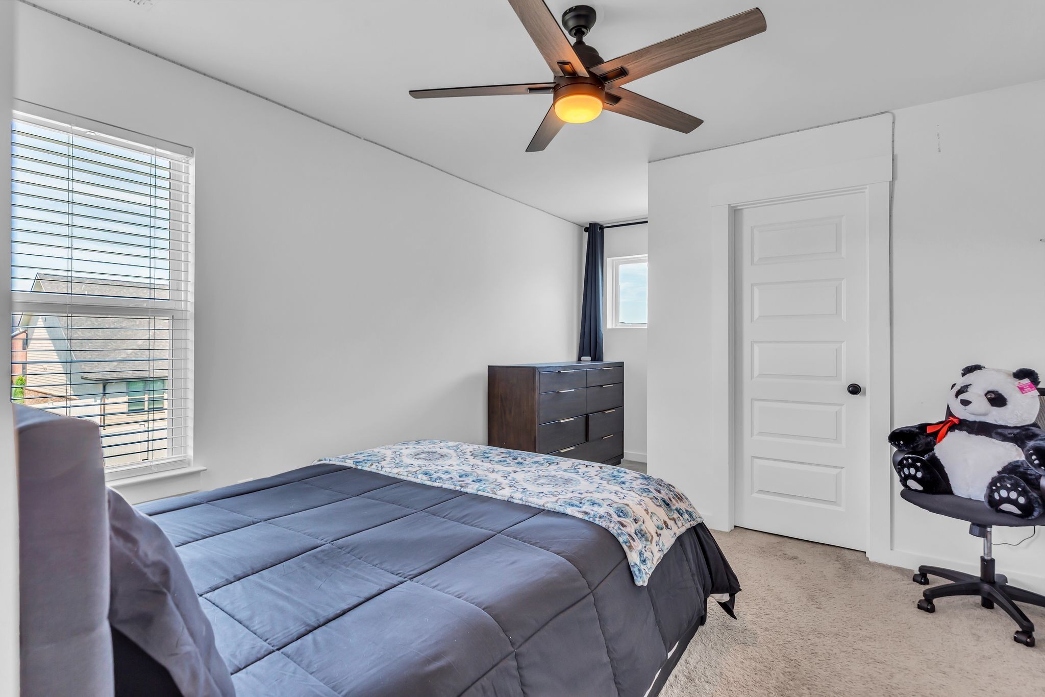 2404 Beaver Drive Murfreesboro, TN 37128 - Photo 33 of 42 a bedroom with a bed and a chandelier