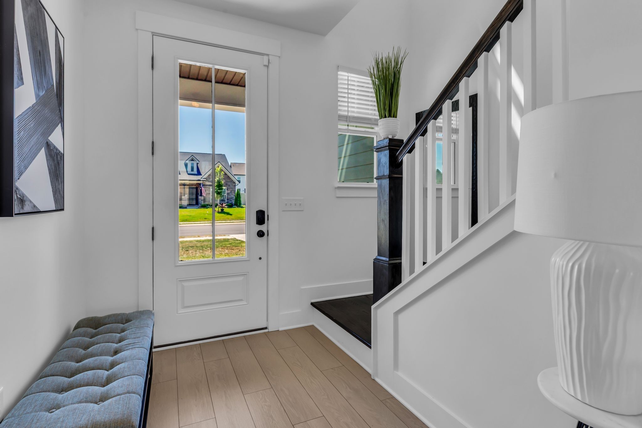 2404 Beaver Drive Murfreesboro, TN 37128 - Photo 6 of 42 a view of a hallway with wooden floor and staircase