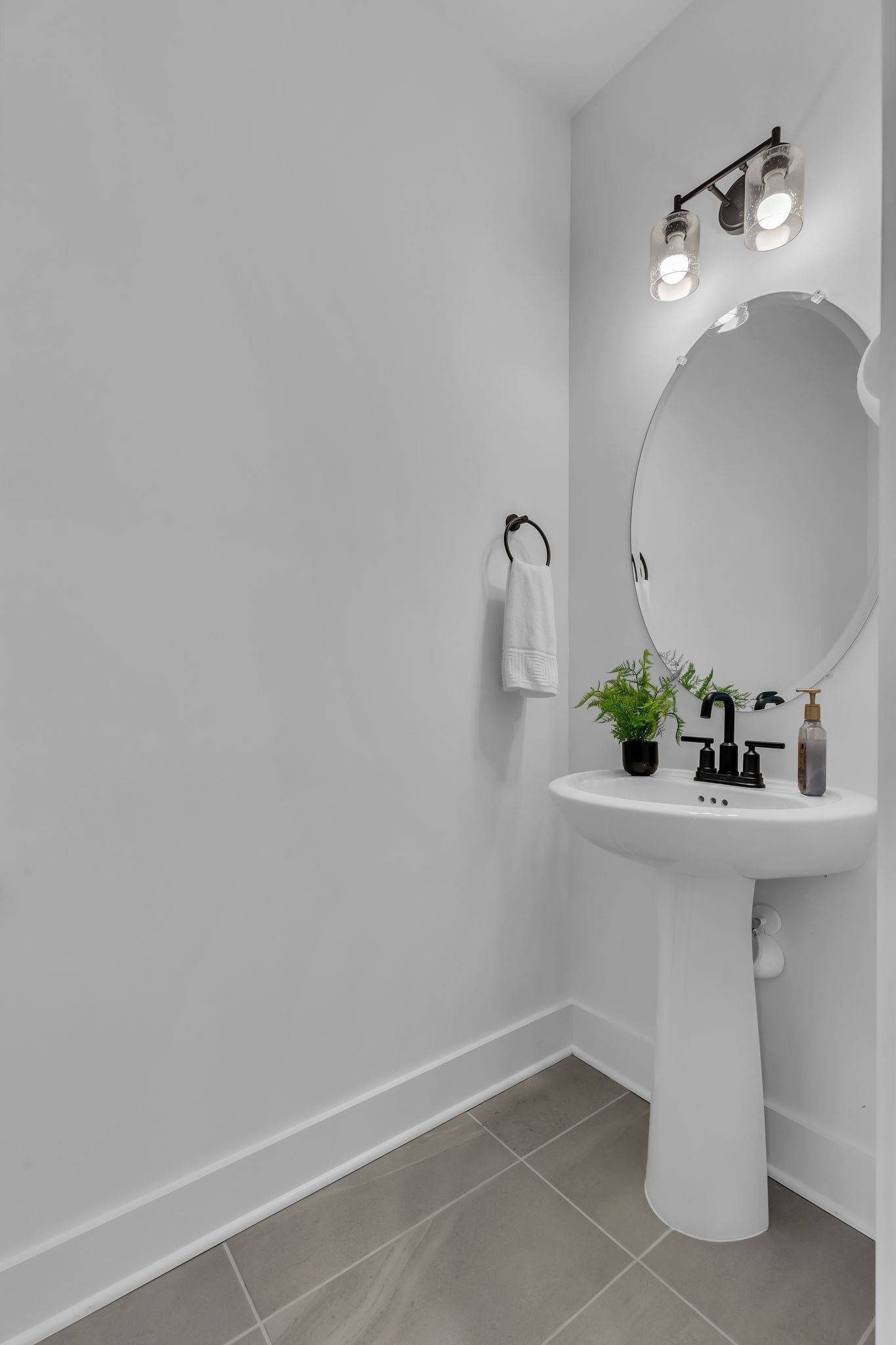 2404 Beaver Drive Murfreesboro, TN 37128 - Photo 9 of 42 a bathroom with a sink and mirror