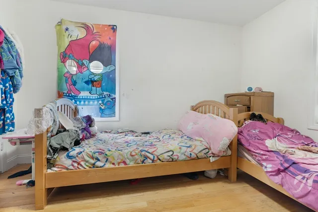 a bedroom with a bed and dresser