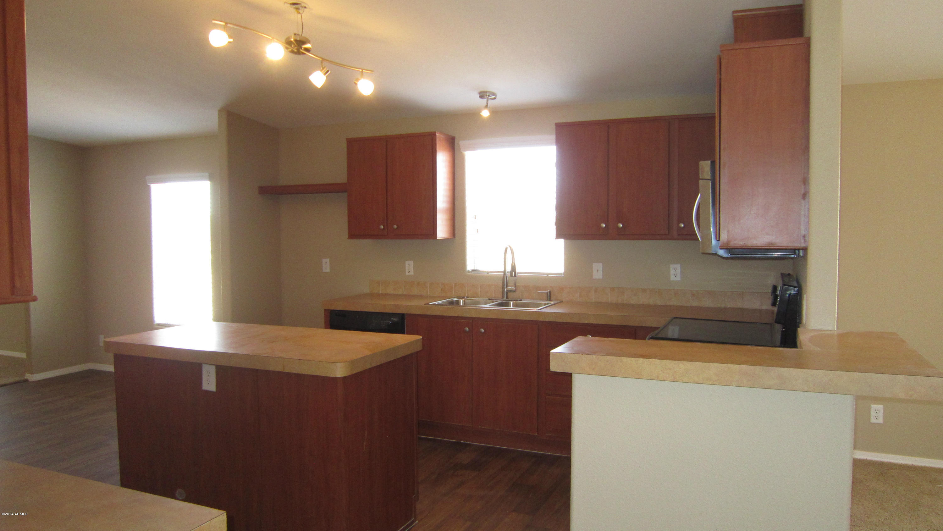 54016 West Ridoway Road Maricopa, AZ 85139 - Photo 15 of 37 Kitchen w island & new lighting