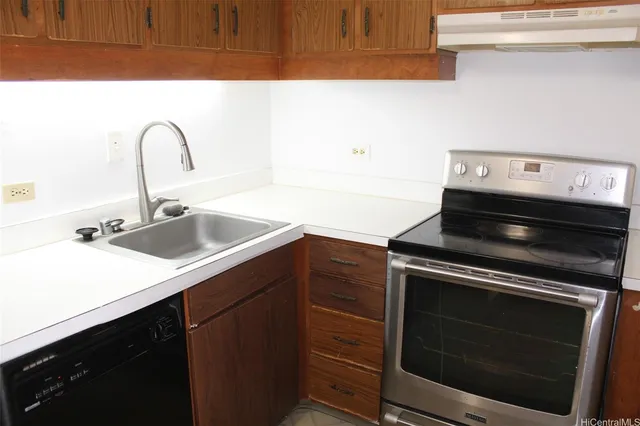 a kitchen with a stove and a sink