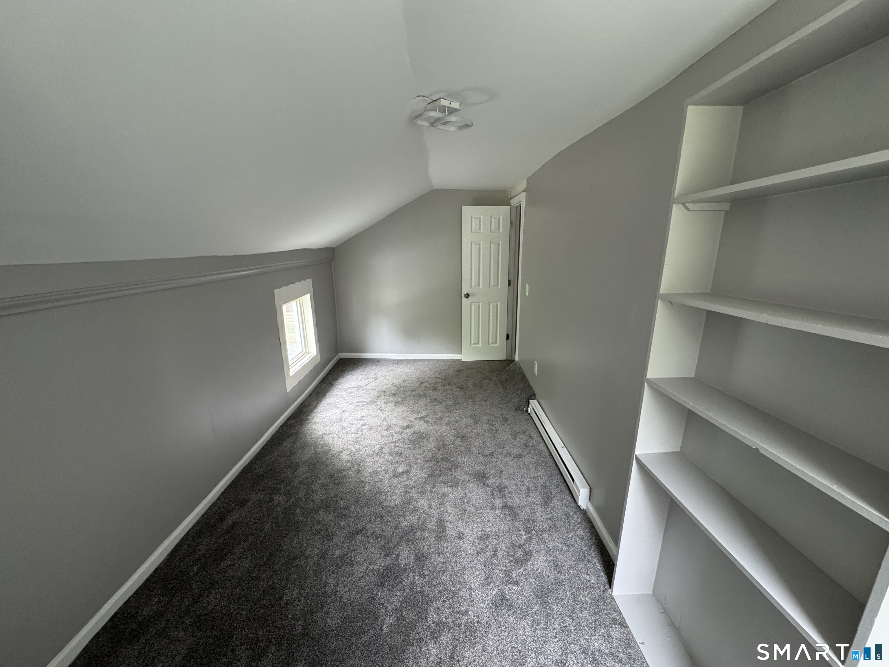 10 Center Street Windsor Locks, CT 06096 - Photo 11 of 25 a view of room with window and stairs
