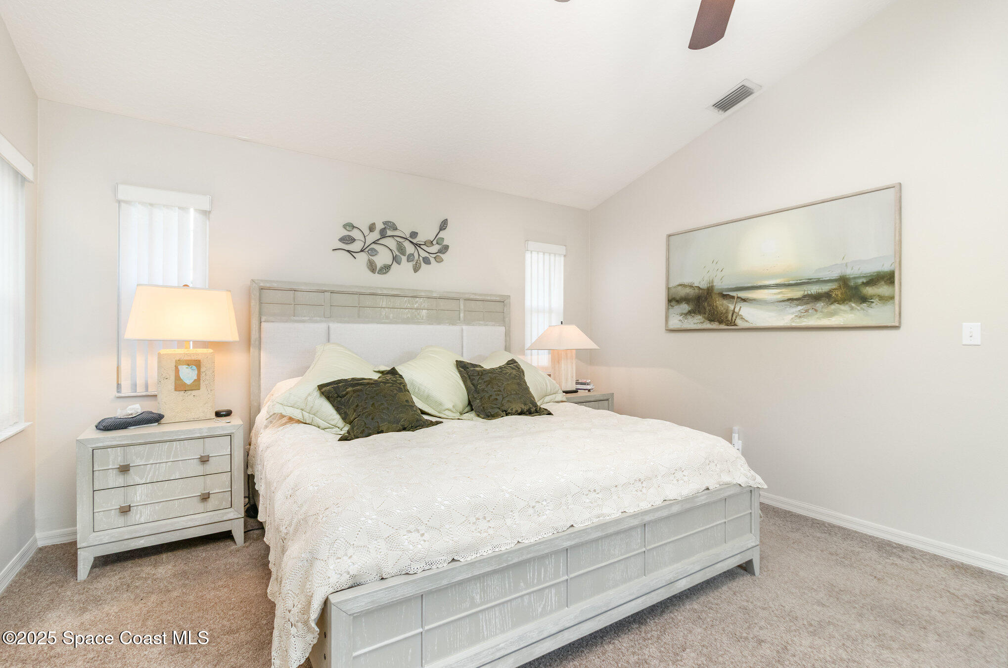 1484 Independence Avenue Melbourne, FL 32940 - Photo 12 of 30 a bedroom with a bed and a night stand