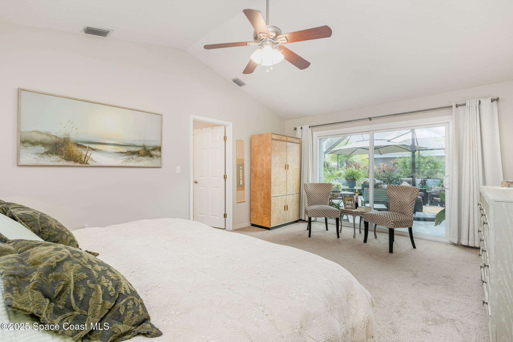 1484 Independence Avenue Melbourne, FL 32940 - Photo 13 of 30 a bedroom with a bed and a large window
